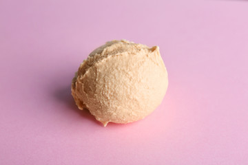 Tasty vanilla ice cream on color background