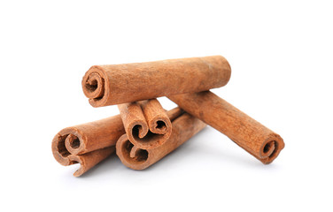 Aromatic cinnamon sticks on white background