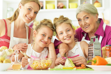 Mom and daughters cook 