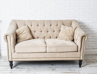 couch the color of coffee with milk on the background of a white