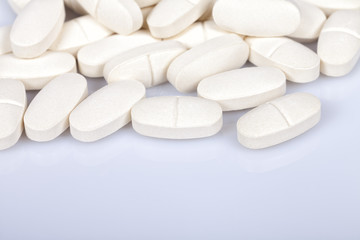 Fototapeta na wymiar Collagen and magnesium pills open isolated on white