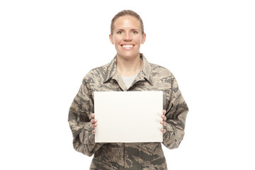 Happy female airman with placard