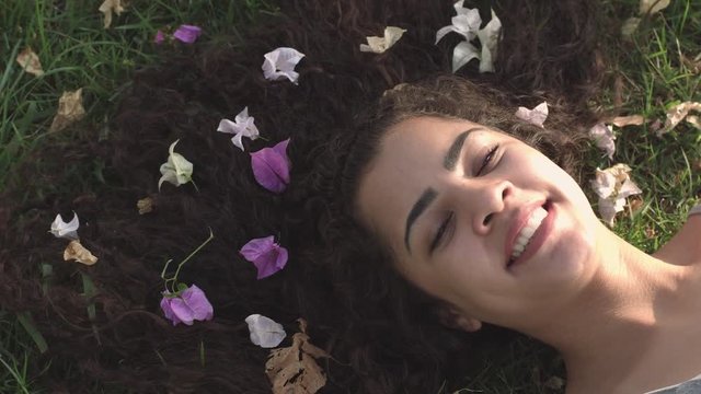 Beauty summer or spring model girl with colorful flowers hair style.