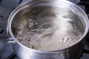 Boiling water in a saucepan