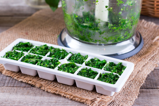 Frozen cubes of herbs - Powered by Adobe