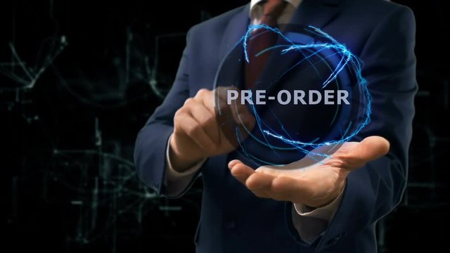 Businessman shows concept hologram Pre order on his hand. Man in business suit with future technology screen and modern cosmic background