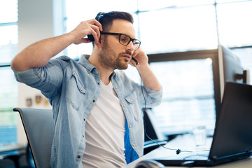Support phone operator in headset at workplace