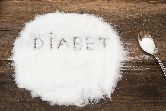 Diabet sign made of granular sugar. The picture illustrates the harm of eating sugar and salt, as well as the incidence of diabetes.