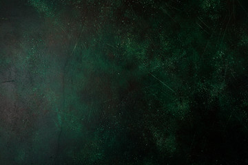 Dark green stone or slate wall. Grunge texture background.