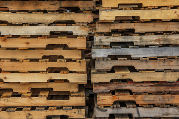 Used pallets, stacked, background