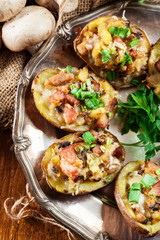 Baked potatoes stuffed with bacon, mushrooms and cheese