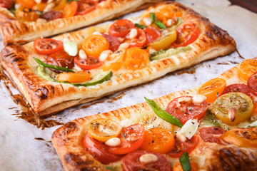 puff with avocado, cherry tomatoes, blue cheese sauce, shallots. concept of a healthy breakfast with ingredients nearby