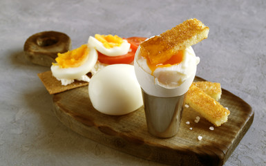 Breakfast. eggs soft-boiled on a gray background.