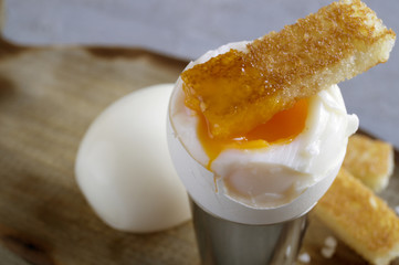 Breakfast. eggs soft-boiled on a gray background.