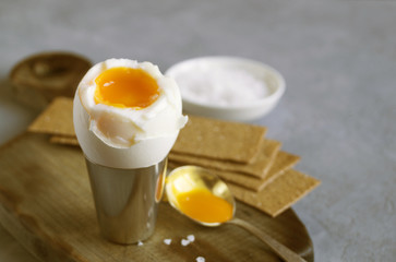Breakfast. eggs soft-boiled on a gray background.