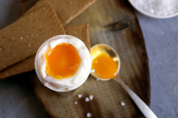 Breakfast. eggs soft-boiled on a gray background.