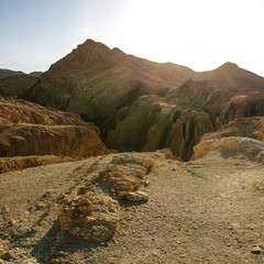 Atlas mountains near Chebika in strong sun back light.