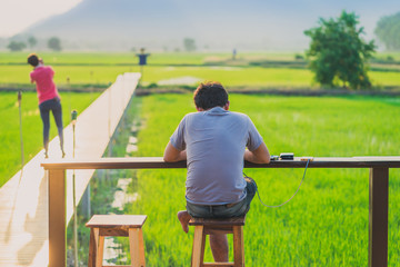 Freelance man waiting to contact the job via mobile phone before