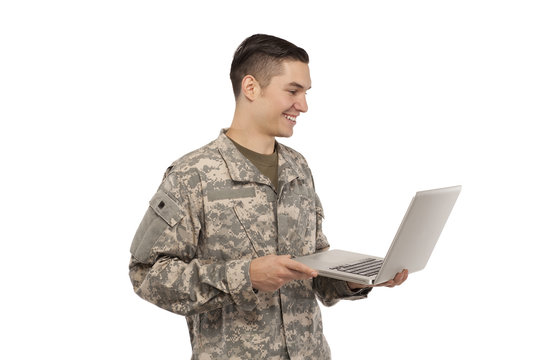 Side view of soldier with laptop