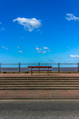 Bench on the promenade looking out to sea