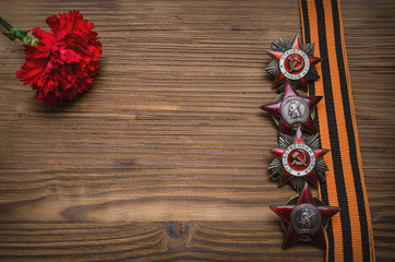 9 nine may Victory day background with copy space. Russian Inscriptions on war Veteran medals: "proletarians of all countries unite" and on another "great national war"..