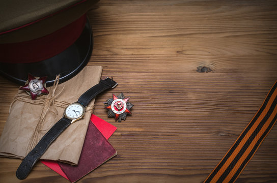 9 nine may Victory day. Medal of red banner, military cap and notes from the front and Saint George ribbon. 