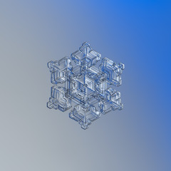 Snowflake glittering on smooth gradient background. Macro photo of real snow crystal: sectored plate with glossy relief surface, fine hexagonal symmetry, six tiny arms and complex inner pattern.