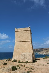 Ghajn Tuffieha Tower at Ghajn Tuffieha Bay on the Mediterranean sea in Malta 