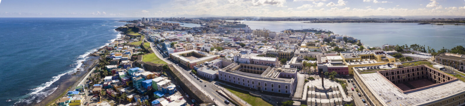 180 degree aerial panorama of Old San Juan, Puerto Rico with harbor in the background.