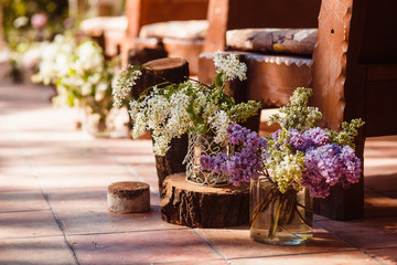 Wedding decoration ceremony. Fresh flowers in vases