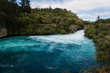 Fototapeta na wymiar Huka Falls flowing into the bottom of the river in New Zealand. 