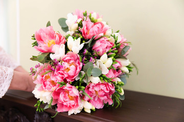 Beautiful wedding bouquet of flowers in bride’s hands