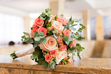 Beautiful bridal bouquet of different flowers with eucalyptus leaves