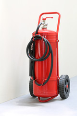 red fire extinguisher ready in case of emergency fire