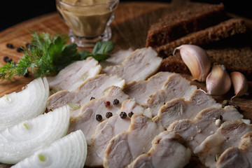 Salo with meat on a wooden board