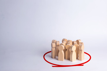 A group of people are standing in a circle on a white background. Wooden figures. Community, party. Statistics and public opinion, social sentiment. Collective, people and minorities.