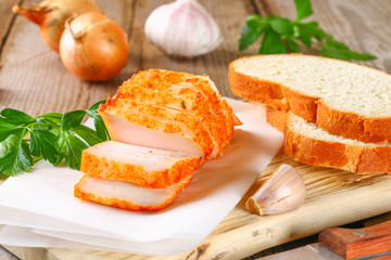 Pork lard with greens on a wooden table.