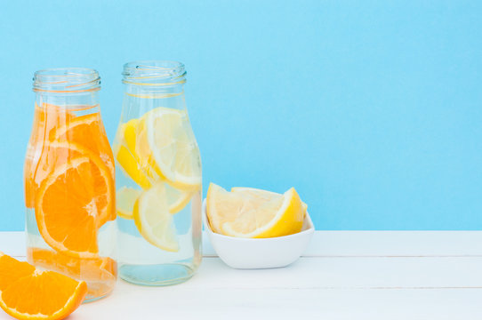 Orange and lemon detox water. Close up view. Space ror text