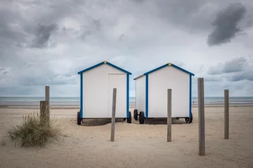 Gordijnen Two vintage beach huts on the beach of De Panne, Sunday 23 July 2017, De Panne, Belgium. © Erik_AJV