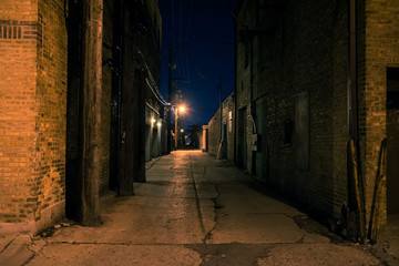 Dark and eerie urban city alley at night