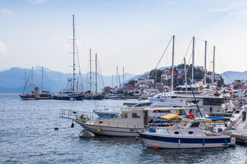 Fototapeta premium Pleasure boats and yacht at the sea pier in Marmaris, Turkey