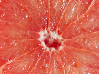 macro of red grapefruit texture