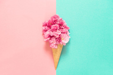 Cherry tree blossom in ice cream waffle cone Pink flowers