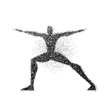 Man doing yoga pose in particle dust splash