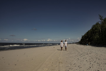 Summer time on beach and two lovers 