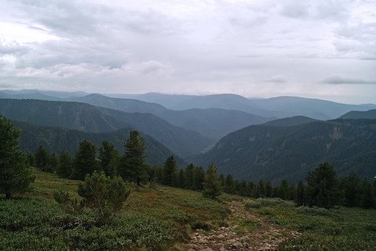 mountain path on the slope of the Baikal ridge in cloudy weather