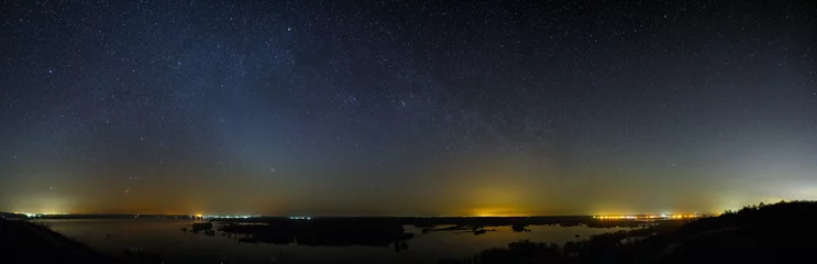 Tuinposter Night sky with the stars of the Milky Way galaxy. Panoramic view of the starry space. © olgapkurguzova