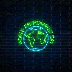 Neon sign of world environment day with globe symbol and greeting text on dark brick wall background.