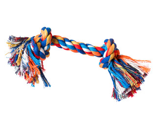 Obraz na płótnie Canvas Dog toy - colorful cotton rope for games, isolated on white background with copy space