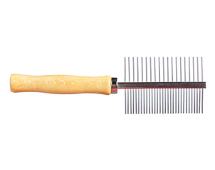 Close up shot of a dogs grooming brush. Comb for the animals.